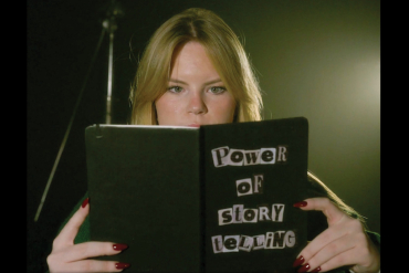 Girl reading a book with title Power of storytelling